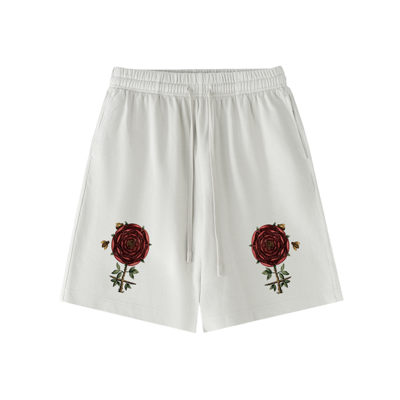 Close up of rose and bees emblem printed on hermetic shorts