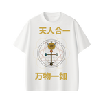 Flat lay of Monas Hieroglyphica occult art shirt with candles and manuscript